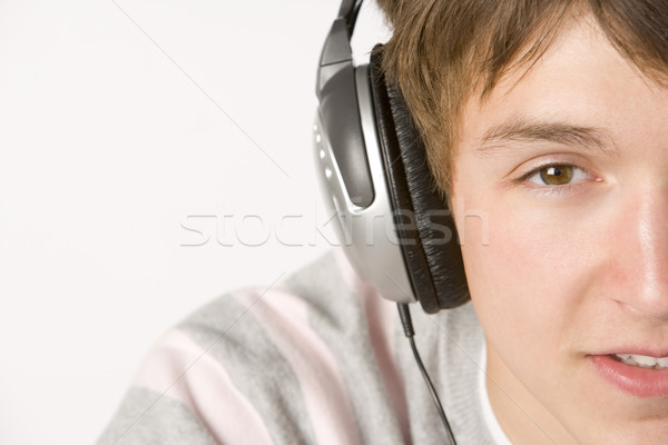 Escuchar música auriculares feliz color adolescente Foto stock © monkey_business