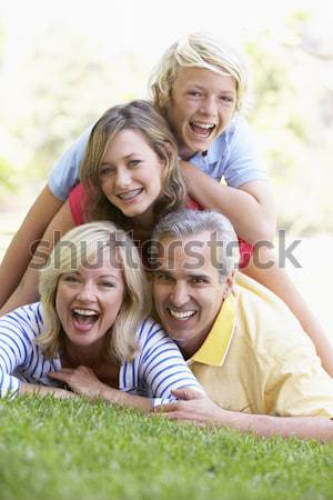 Three Generation Family Relaxing On Beach Holiday Stock photo © monkey_business