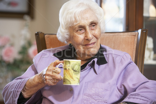 Senior woman drinking hot beverage Stock photo © monkey_business