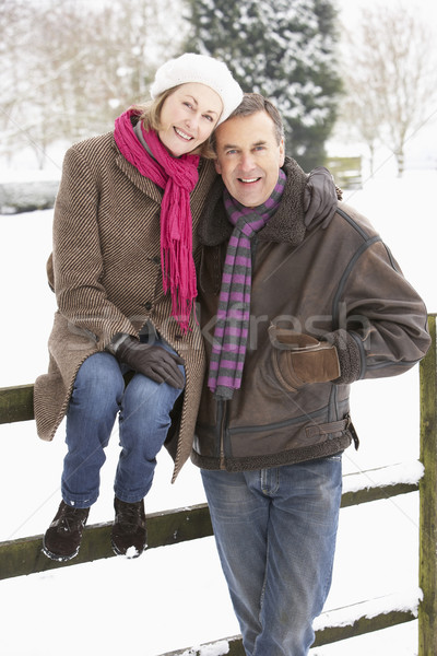 Senior Couple Standing Outside In Snowy Landscape Stock photo © monkey_business