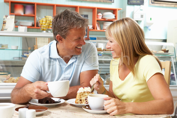 Couple Enjoying Slice Of Cake And Coffee In Caf Stock photo © monkey_business