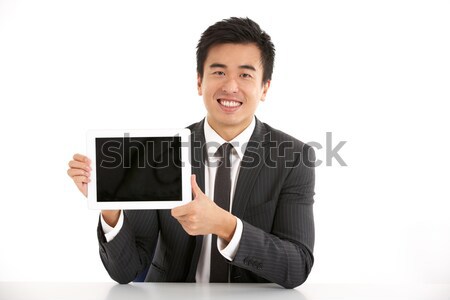 Studio Shot Of Chinese Businessman Working On Laptop Stock photo © monkey_business