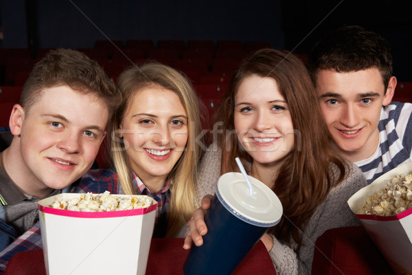 Group Of Teenage Friends Watching Film In Cinema Stock photo © monkey_business