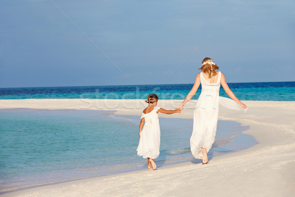 Bride With Bridesmaid At Beautiful Beach Wedding Stock photo © monkey_business