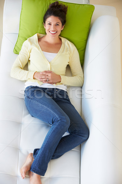 Overhead View Of Woman Relaxing On Sofa Stock photo © monkey_business
