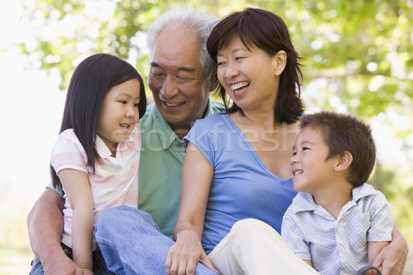 Grands-parents rire petits enfants famille fille heureux [[stock_photo]] © monkey_business