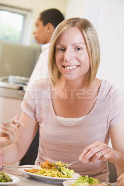 Stock photo: Teacher enjoying her lunch in a school cafeteria