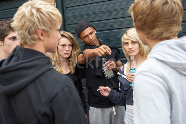 Group Of Threatening Teenagers Hanging Out Together Outside Drin Stock photo © monkey_business