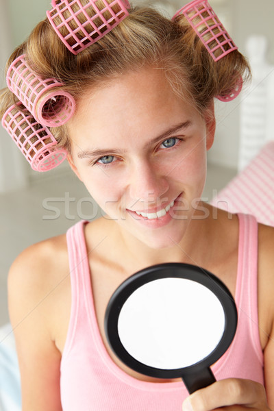 Teenage girl with hair in curlers Stock photo © monkey_business