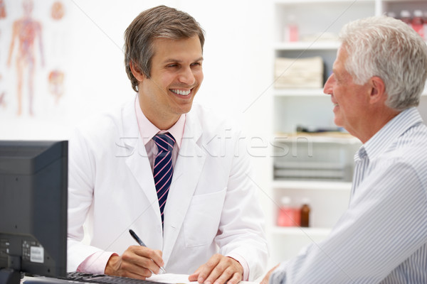 Doctor with senior patient Stock photo © monkey_business