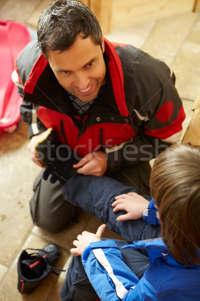 Father Helping Son To Put On Warm Outdoor Clothes And Boots Stock photo © monkey_business