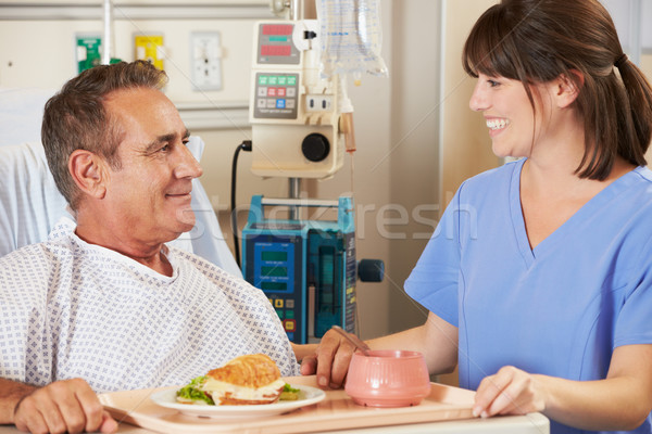 Patienten serviert Essen Krankenhausbett Krankenschwester Mann Stock foto © monkey_business
