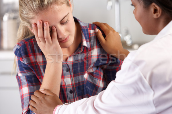 Stock photo: Teenage Girl Visits Doctor's Office Suffering With Depression