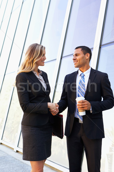 Empresário empresárias aperto de mãos fora escritório negócio Foto stock © monkey_business