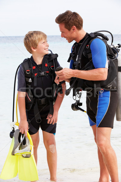Father And Son With Scuba Diving Equipment On Beach Holiday Stock photo © monkey_business