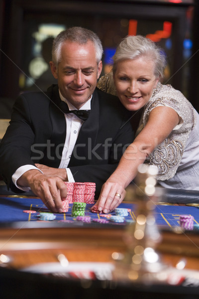 Couple gambling at roulette table Stock photo © monkey_business