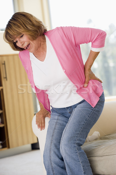 Frau Rückenschmerzen zurück Schmerzen krank Farbe Stock foto © monkey_business