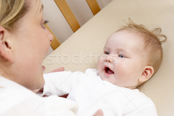 Mother Playing With Baby In Cot Stock photo © monkey_business