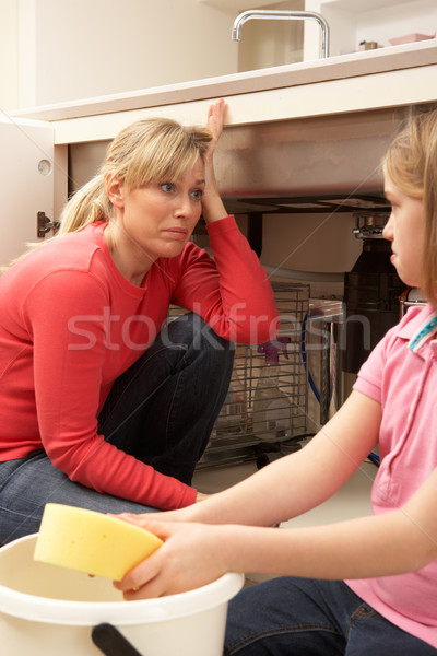 Daughter Helping Mother To Mop Up Leaking Sink Stock photo © monkey_business