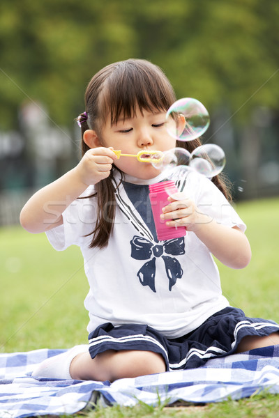 Outdoor bubble asian young
