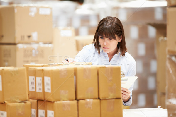 Worker In Warehouse Preparing Goods For Dispatch Stock photo © monkey_business