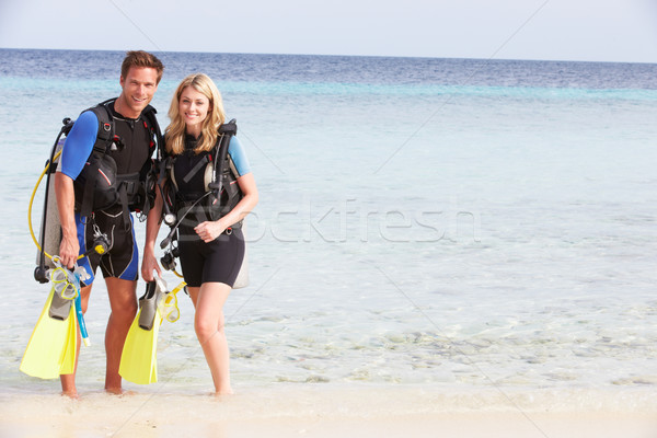 Stock photo: Couple With Scuba Diving Equipment Enjoying Beach Holiday
