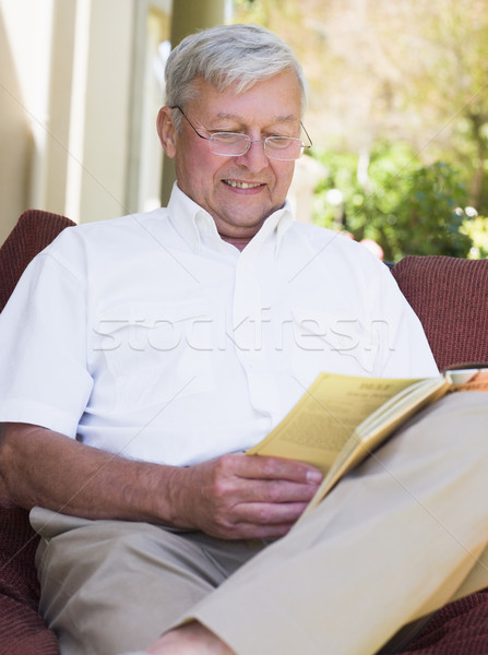Senior man relaxing with book Stock photo © monkey_business