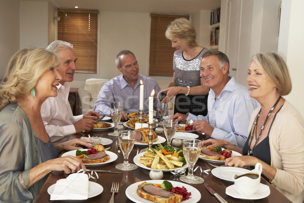 Barátok vacsora vendégekkel étel nők otthon pár Stock fotó © monkey_business