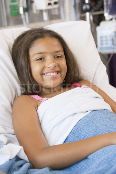 Fiatal lány kórházi ágy gyermek egészség kórház mosolyog Stock fotó © monkey_business