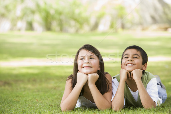 Foto stock: Dois · crianças · relaxante · parque · juntos · menino