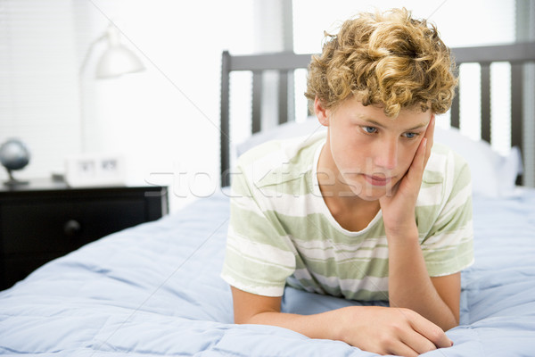 Teenage Boy Lying On Bed Stock photo © monkey_business