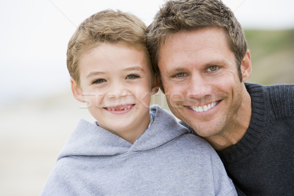 Father and son at beach smiling Stock photo © monkey_business