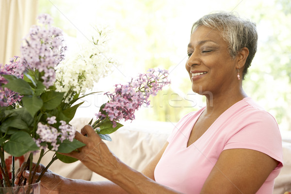Senior Woman Flower Arranging At Home Stock photo © monkey_business