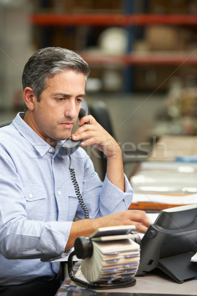 Manager Working At Desk In Warehouse Stock photo © monkey_business