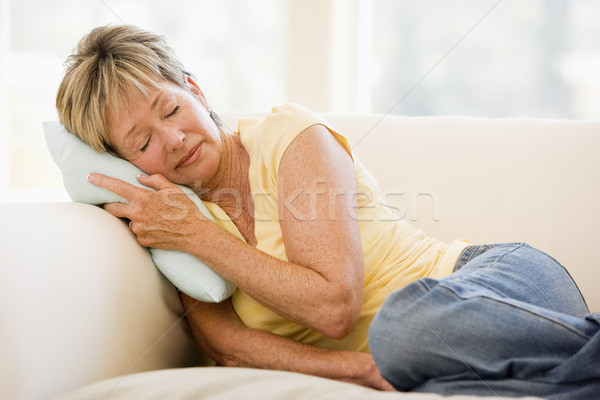 Donna sentimento indisposto divano malati senior Foto d'archivio © monkey_business