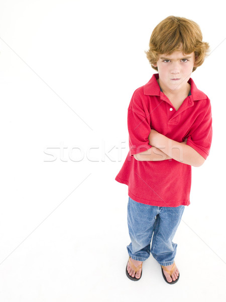 Fiatal srác keresztbe tett kar gyermek fiú stúdió mérges Stock fotó © monkey_business