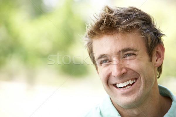 Portret jonge man vergadering park man zomer Stockfoto © monkey_business