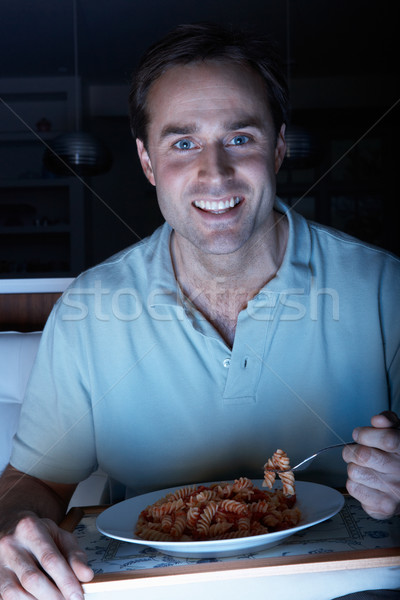 Man Enjoying Meal Whilst Watching TV Stock photo © monkey_business