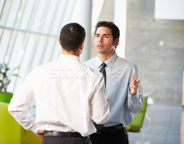 Zwei Geschäftsleute Sitzung modernen Büro Stock foto © monkey_business