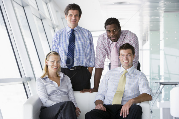 Vier Geschäftsleute Büro Lobby lächelnd Business Stock foto © monkey_business