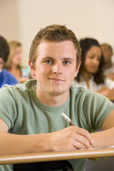 Male college student in a university lecture hall Stock photo © monkey_business