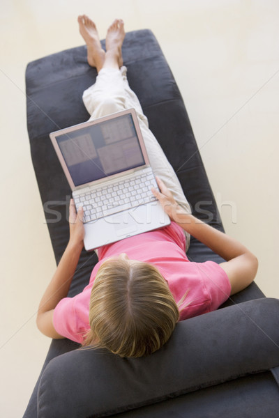 Stock photo: Woman sitting in chair using laptop