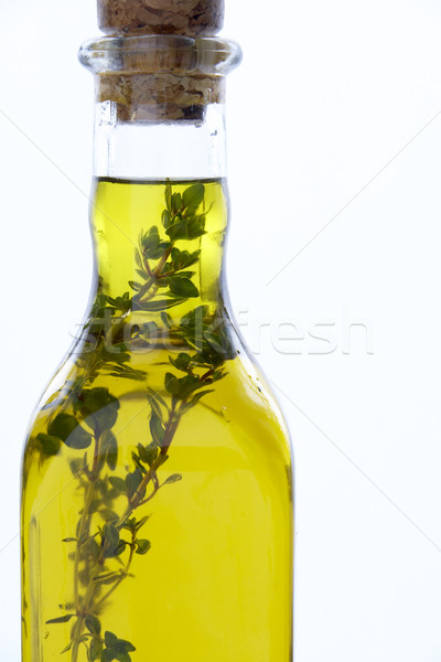 Bottle Of Olive Oil With Herbs Stock photo © monkey_business