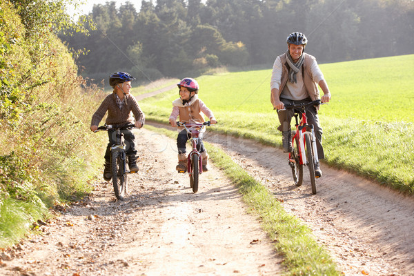 Jeunes père enfants vélos parc fille [[stock_photo]] © monkey_business