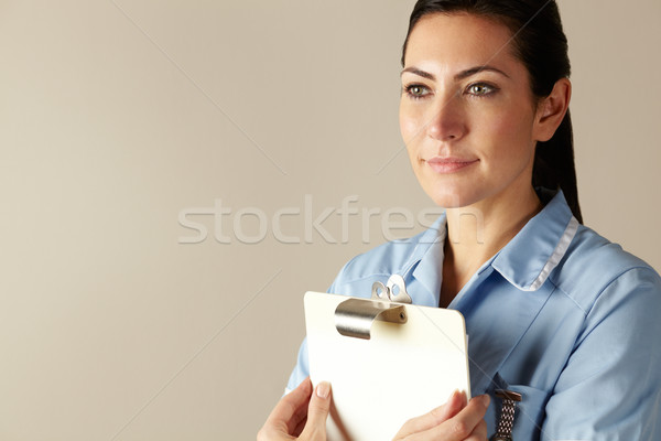 UK nurse holding clipboard Stock photo © monkey_business