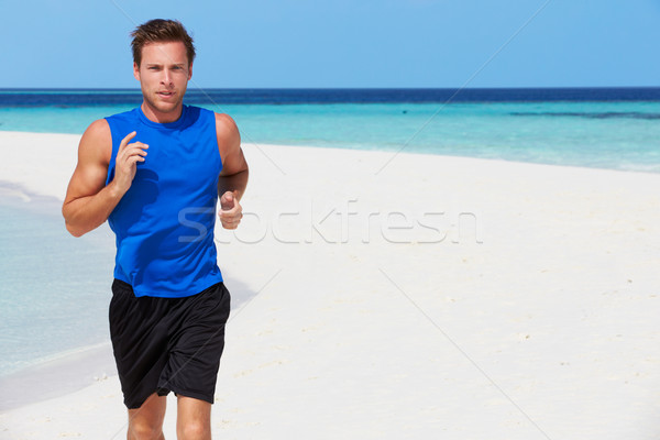 Uomo esecuzione bella spiaggia fitness sabbia Foto d'archivio © monkey_business