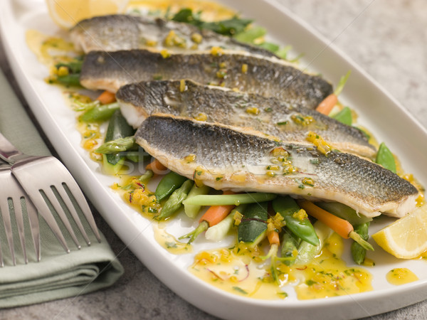 Fillets of Sea bass with Baby Vegetables and Saffron Butter Stock photo © monkey_business