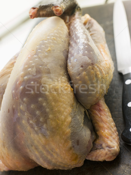 Whole Guinea Fowl on a Chopping Board Stock photo © monkey_business