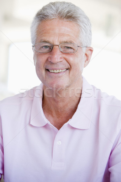 Stock photo: Man Looking Through New Glasses