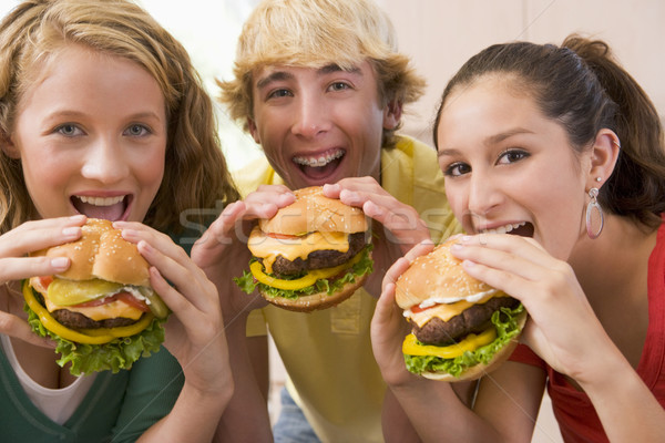 Teenagers Eating Burgers Stock photo © monkey_business